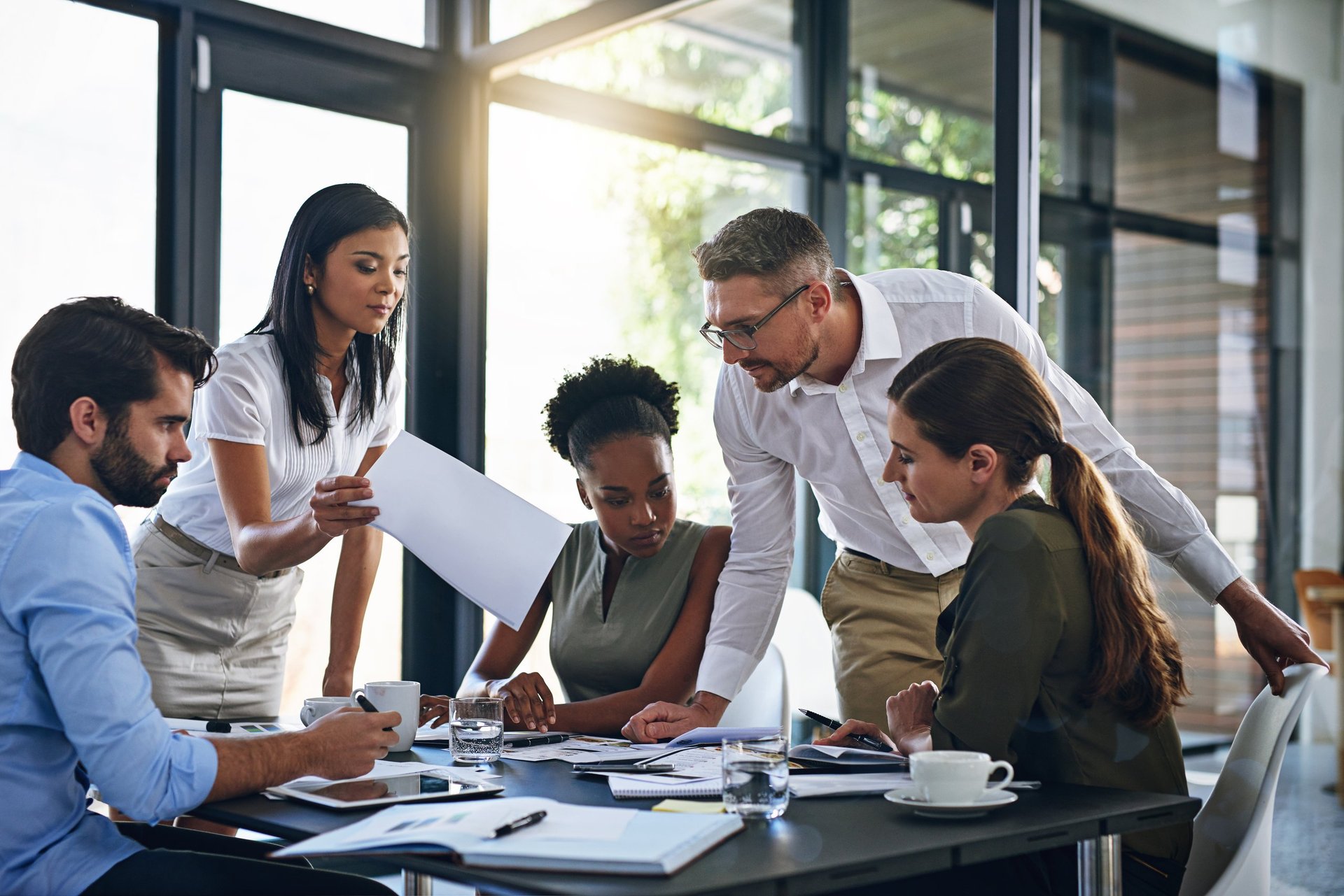 Diverse business team collaborating in modern boardroom